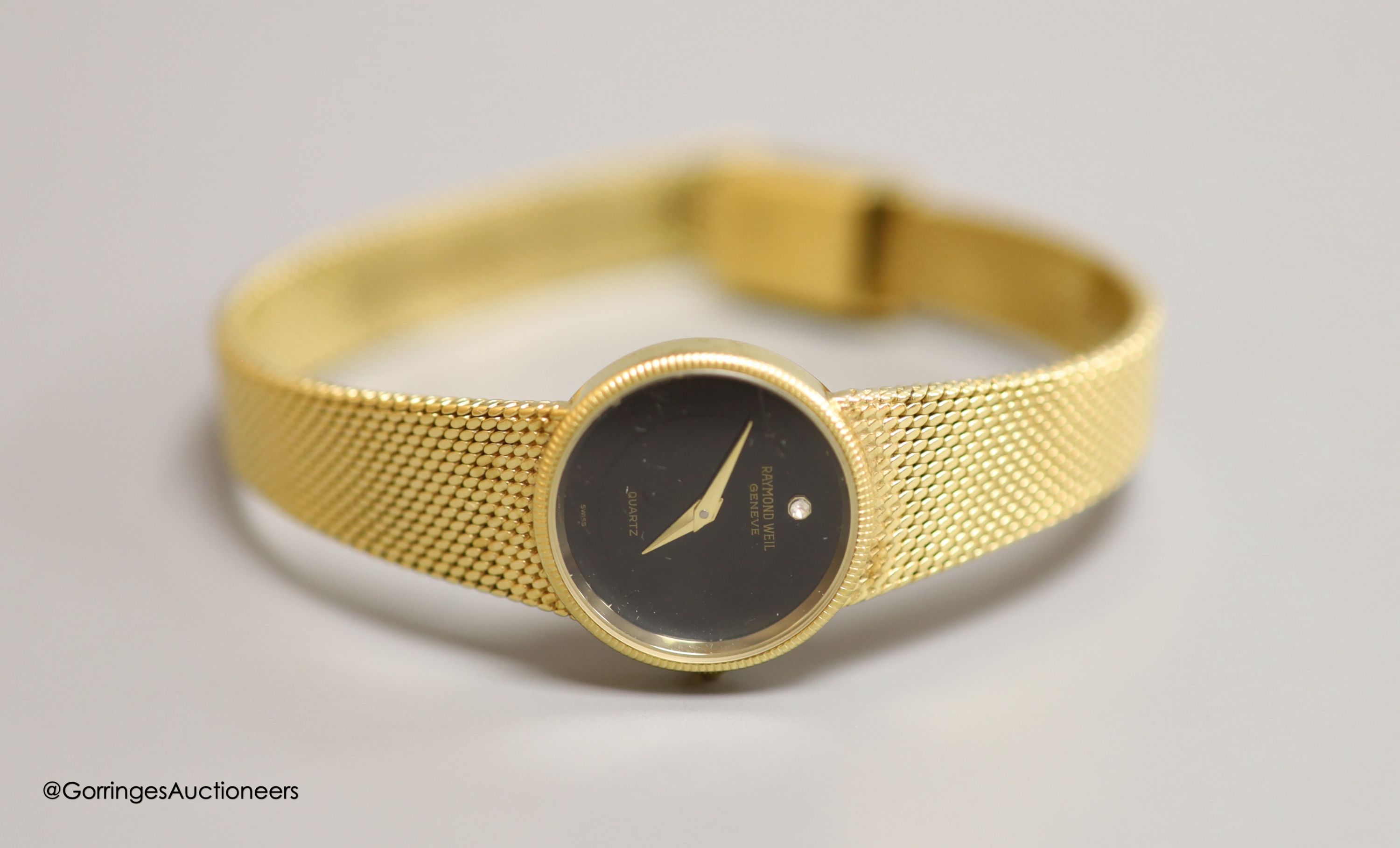 A lady's 18k gold electroplated Raymond Weil quartz wrist watch, overall 20.7cm, with Raymond Weil pouch.